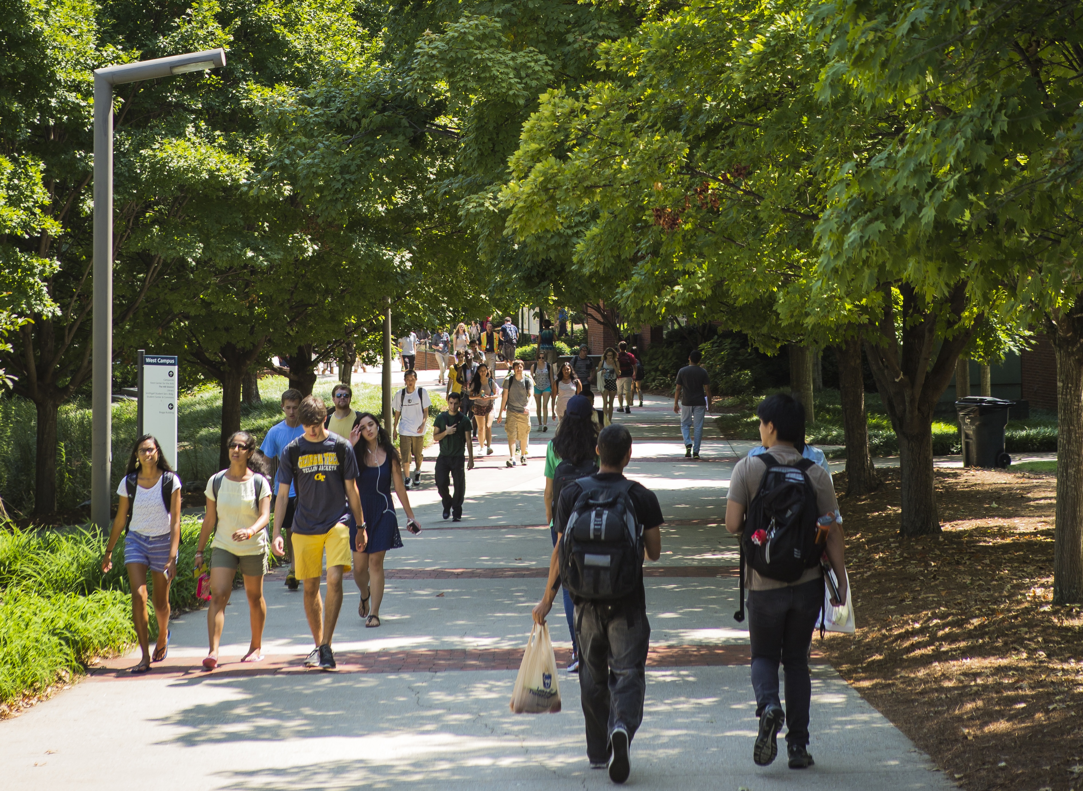 Students walking through trees on Tech campus