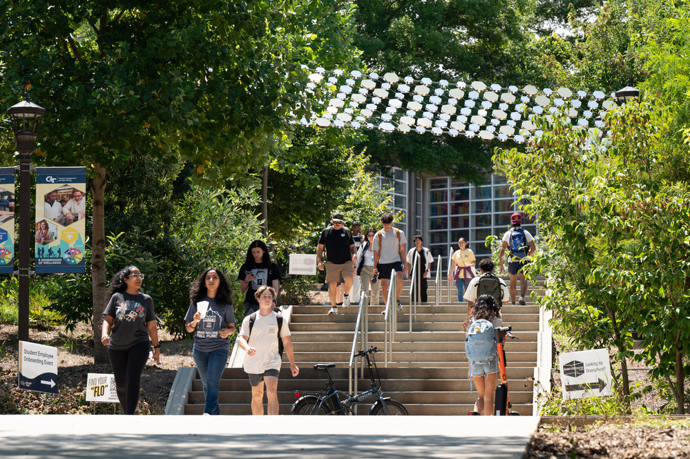 image of students on Tech stairs surrounded by trees